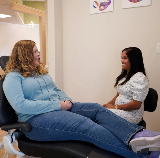 A patient talking with Dr. Yashoni Shah at Petal Dental