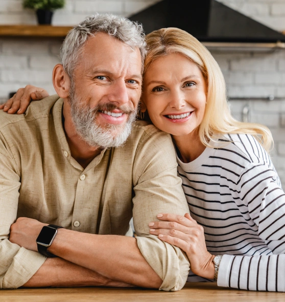 Older man and woman smiling together