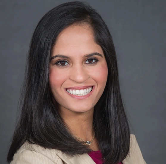 Dr. Yashoni Shah smiling in a professional headshot