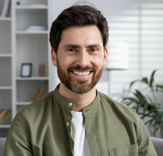 Man smiling with a beard