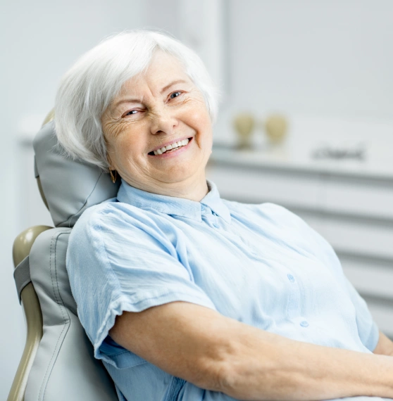 Older woman smiling after root canal therapy